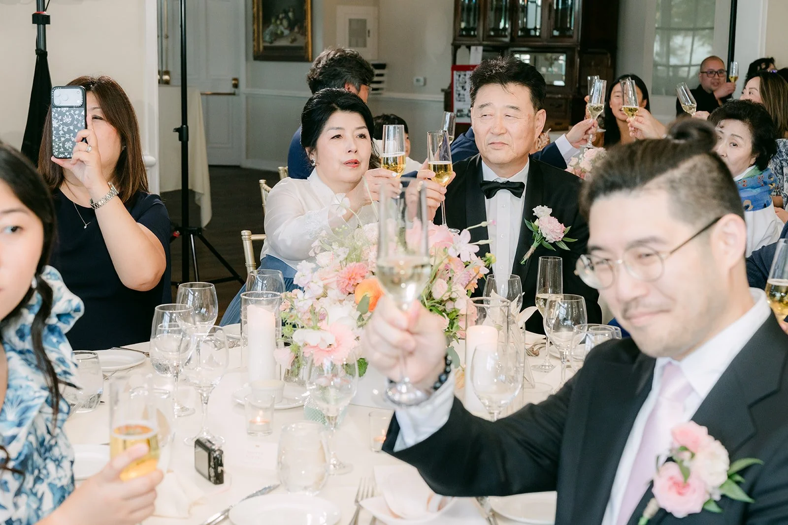 Guests laughing during the toasts