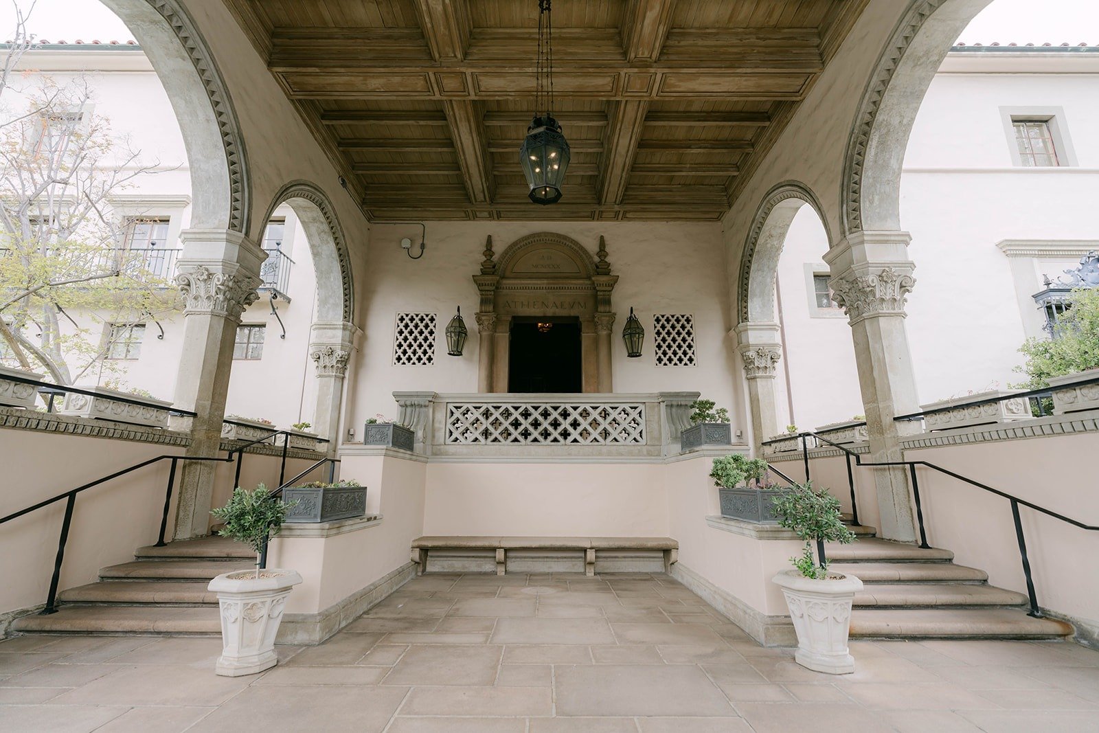 The arched loggia and steps leading to the East Patio at The Athenaeum