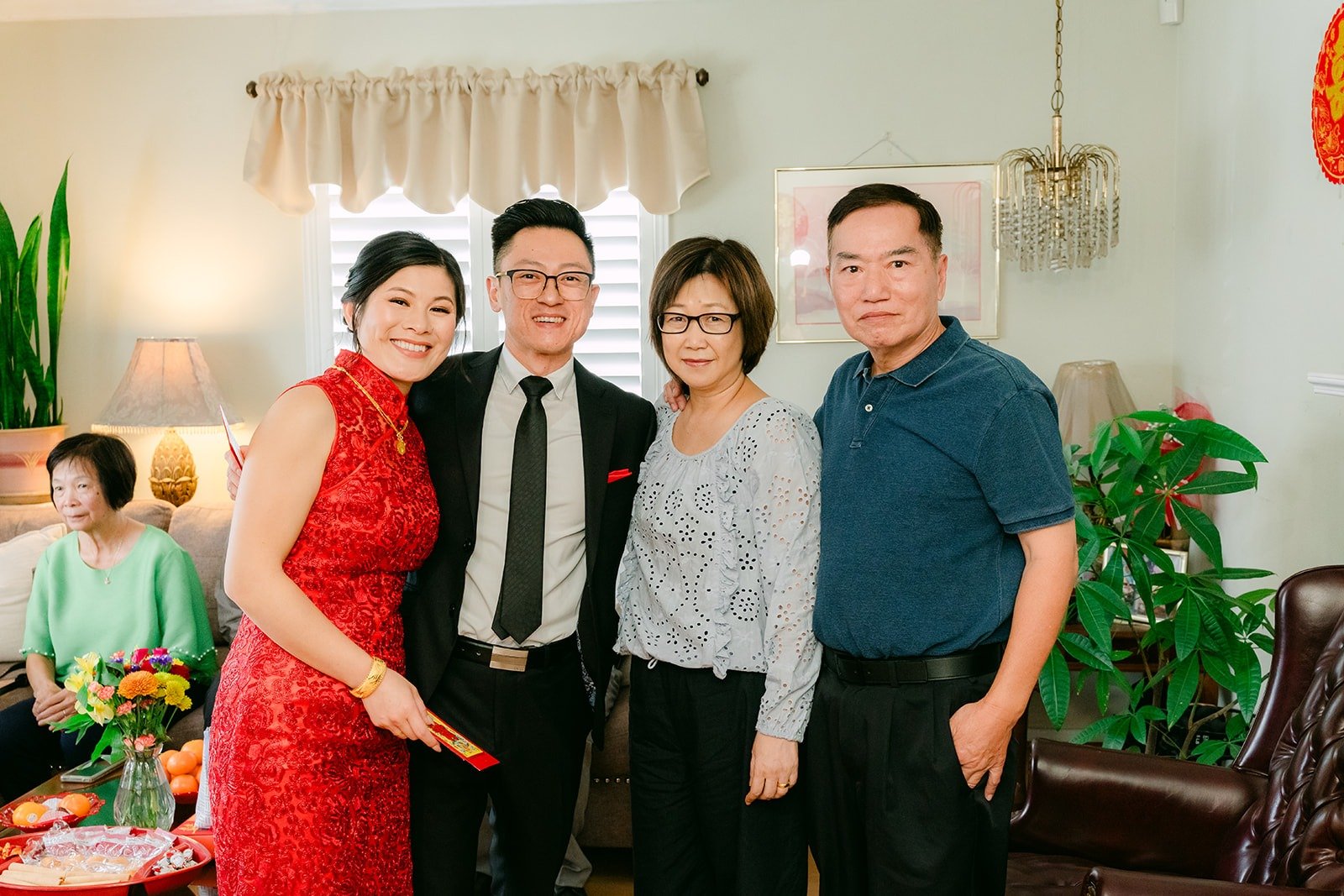 Xuemin and Alex standing with family after tea
