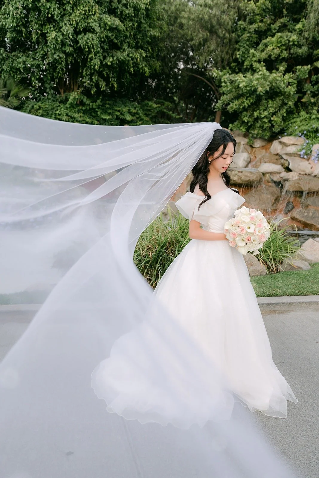 Jeannie's flying veil in front of the rock waterfall