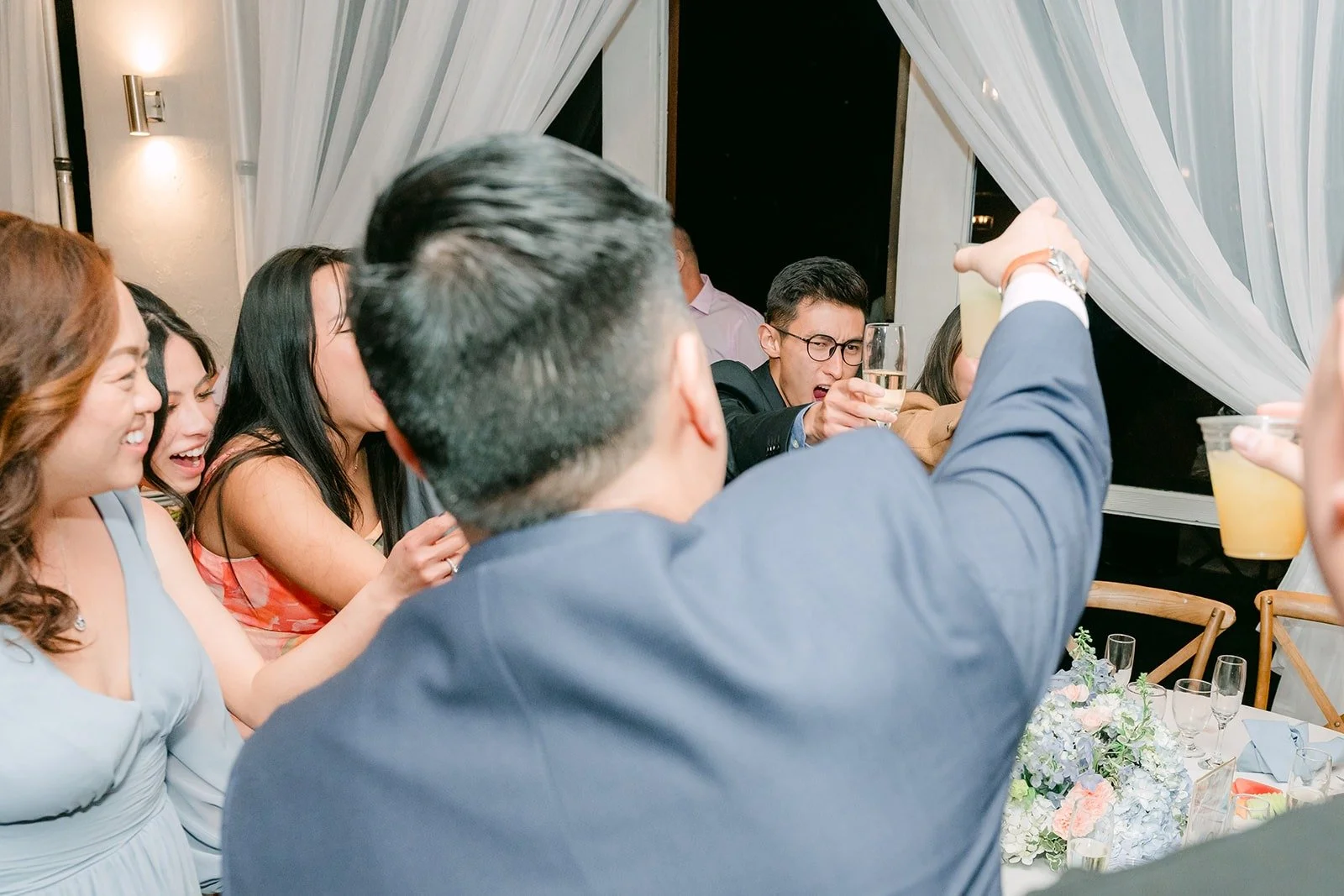 Jordan raising a glass during table toasts