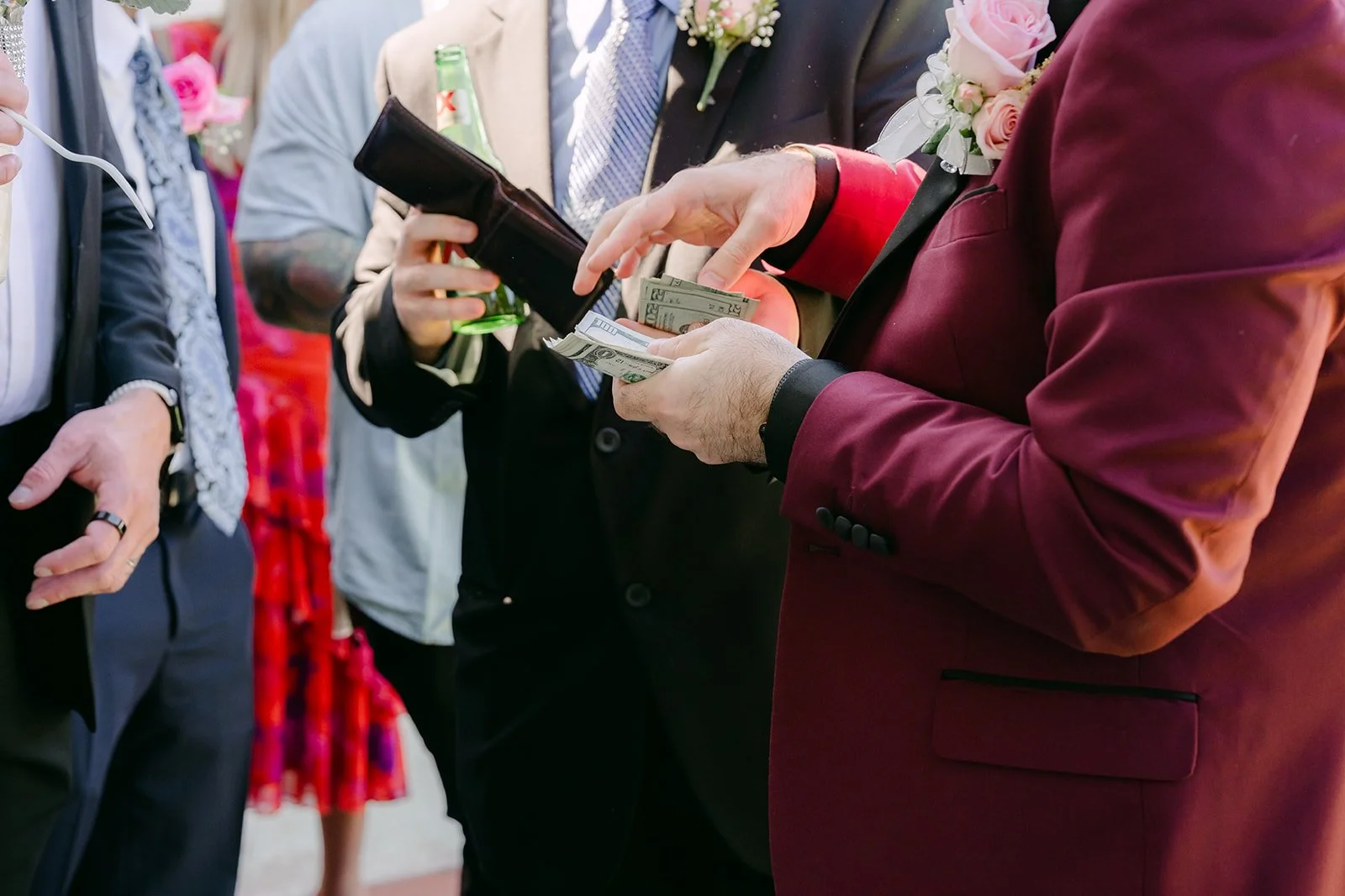 Ryan handing over red envelopes to get through the door.