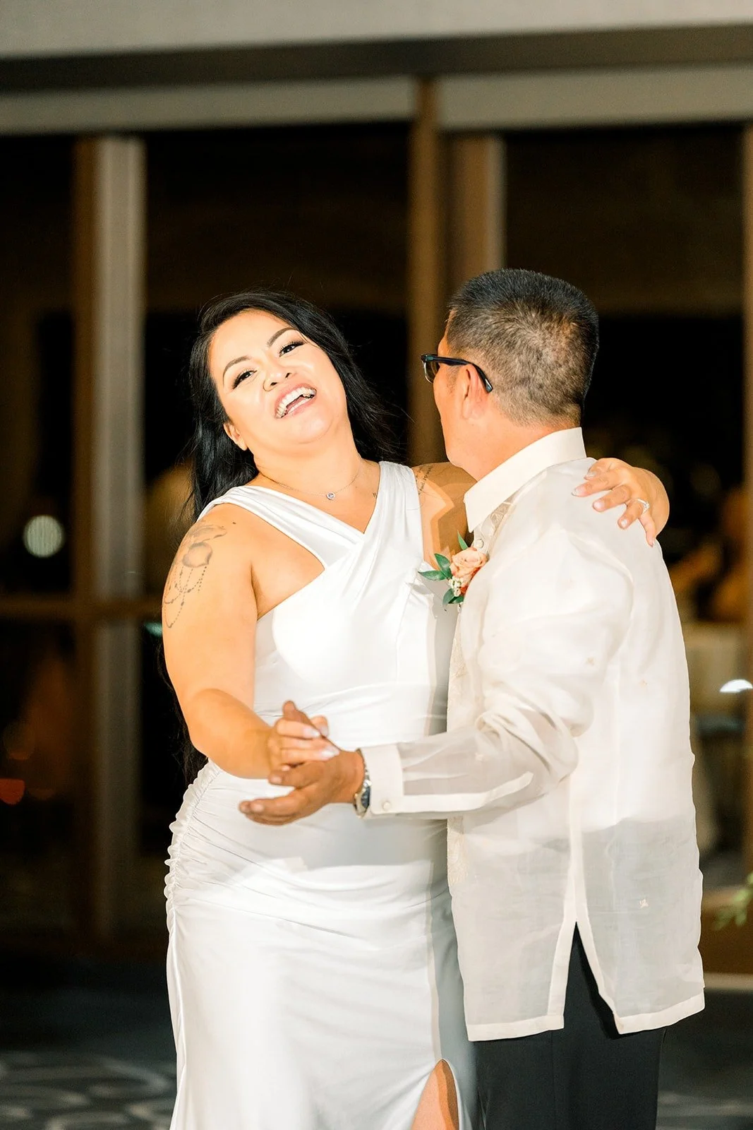 Betsy laughs as she dances with a family member