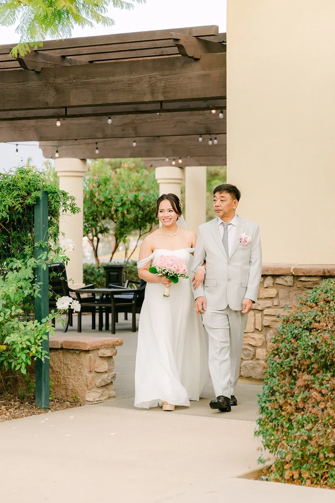 Ivy escorted from the courtyard toward the ceremony