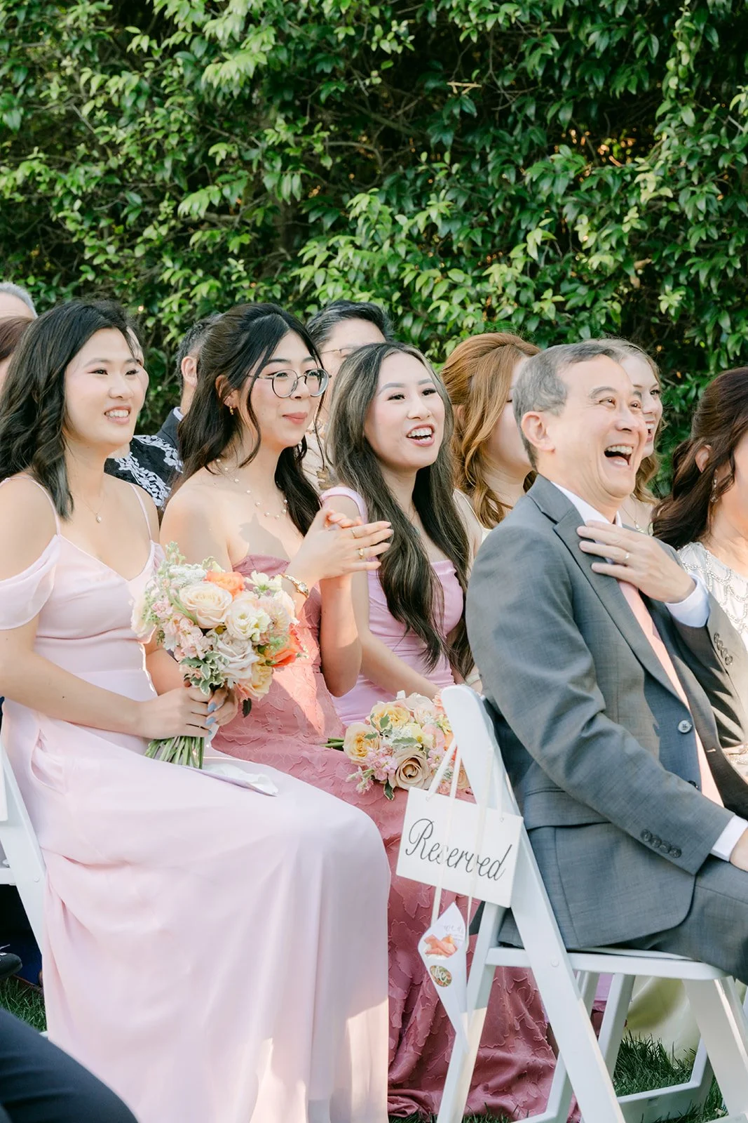 Guests watching the ceremony in the garden