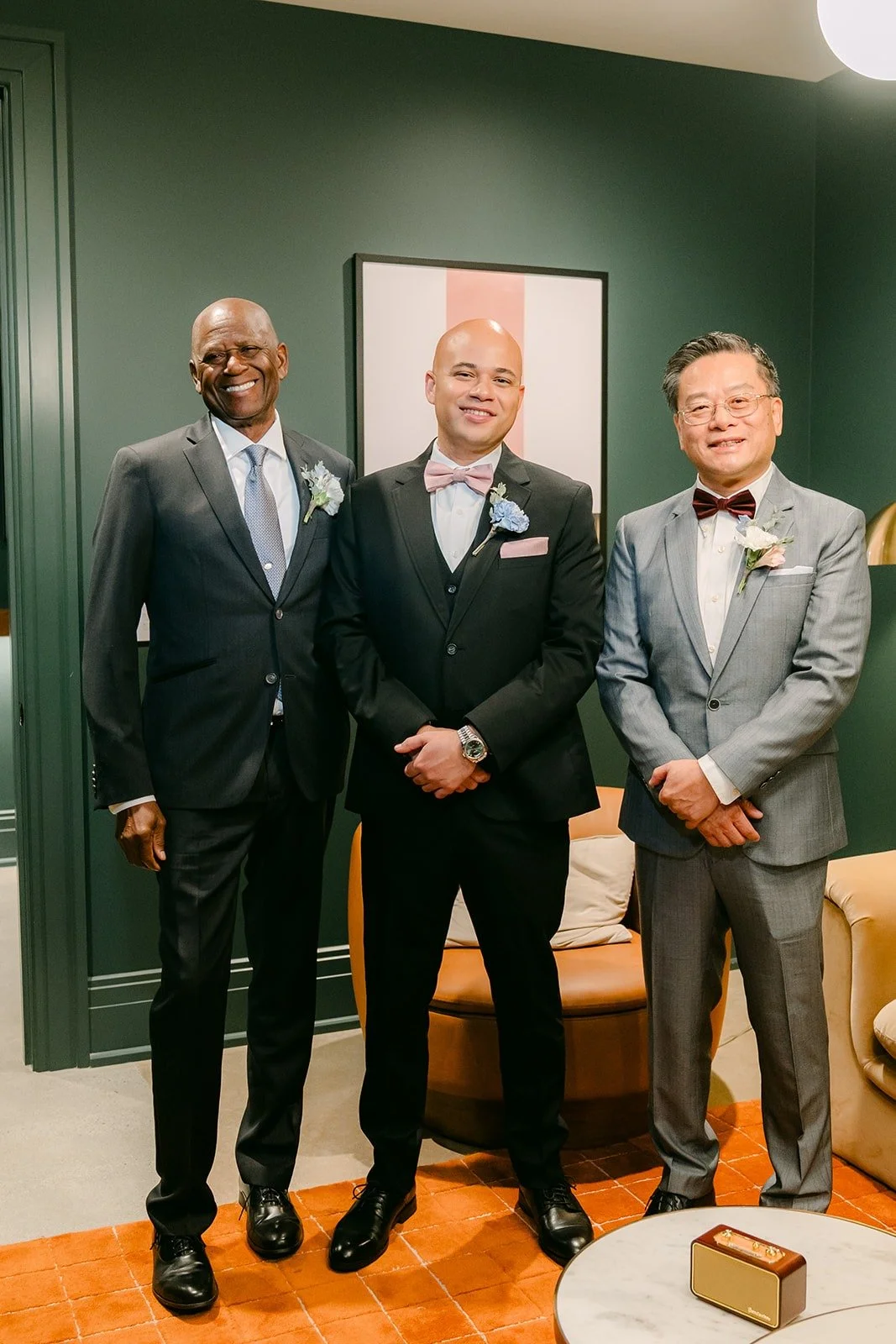 Brandon with two of his groomsmen in the groom's suite