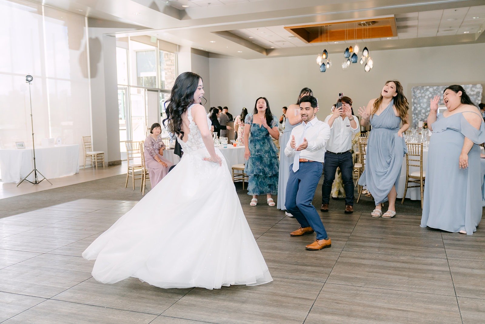 Natalie twirling in her gown on the ballroom dance floor