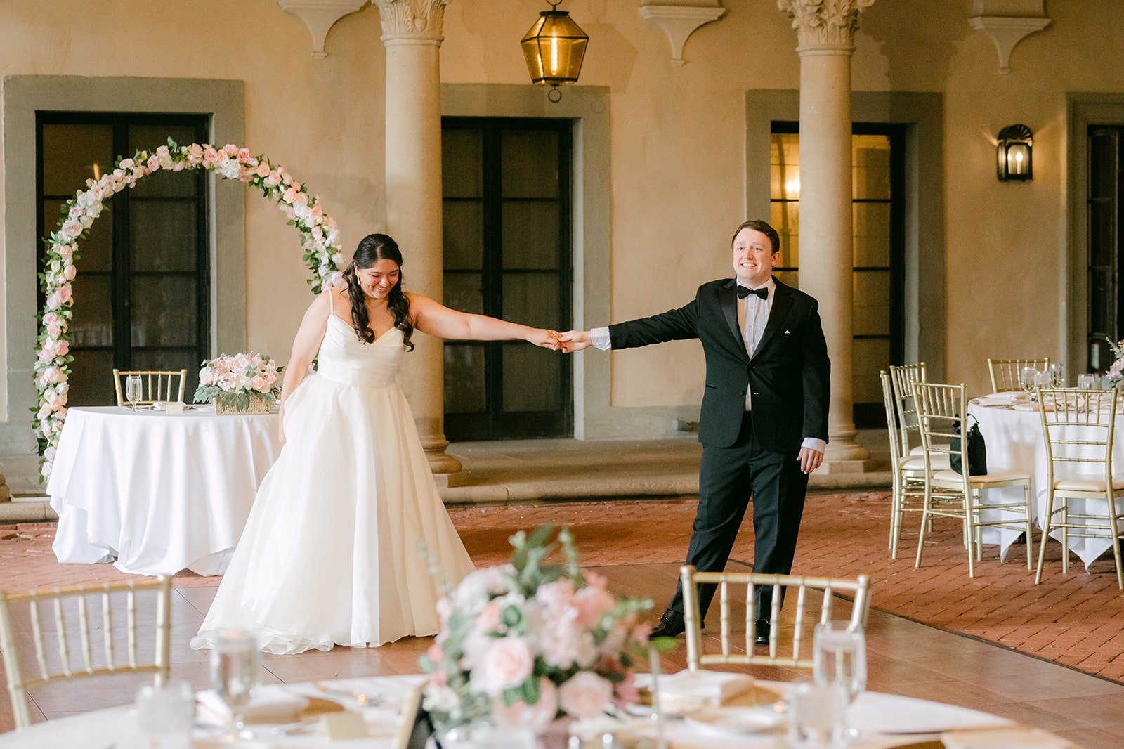 Saira and Matthew starting their private first dance on the empty West Patio