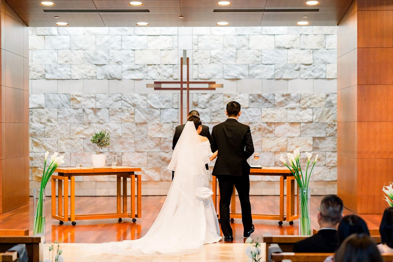 Jacinda and Steven at the altar beneath the cross