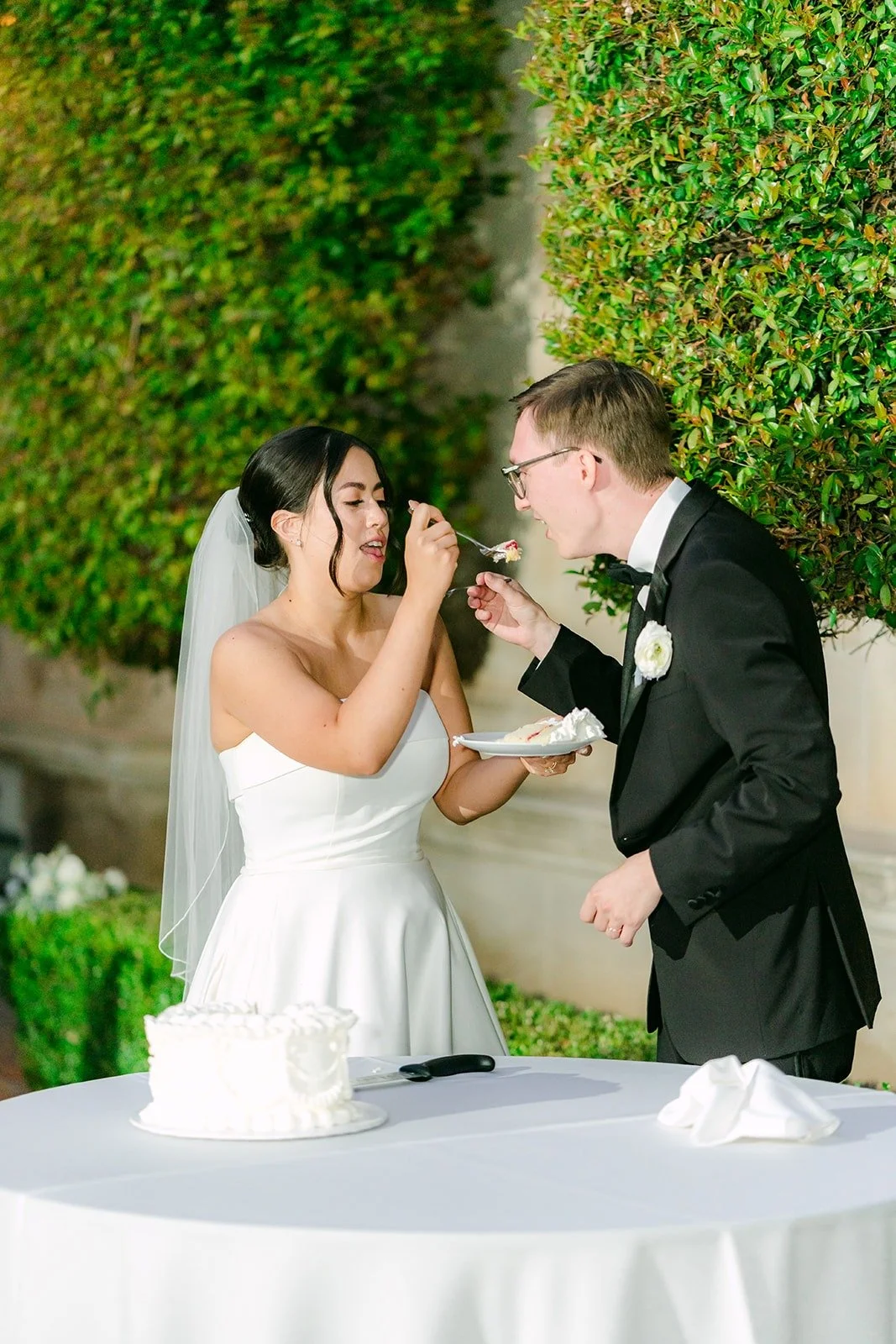 Brianna feeding Nik a bite of cake