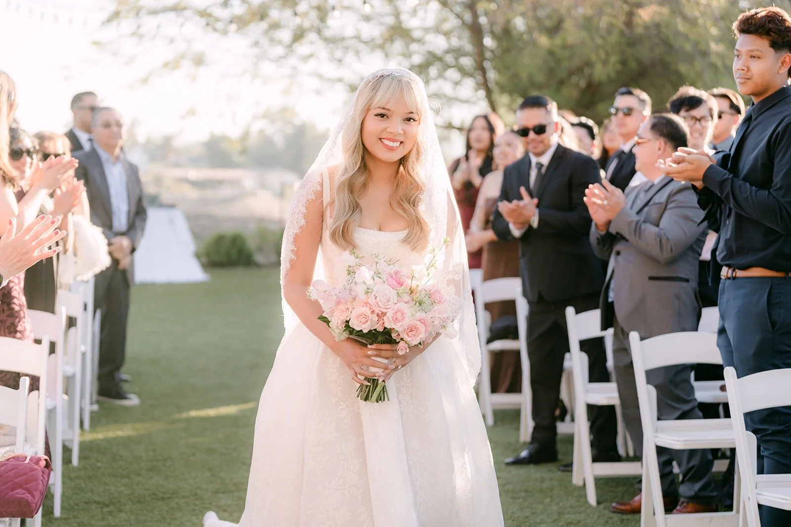 Konitha walking down the aisle toward Job