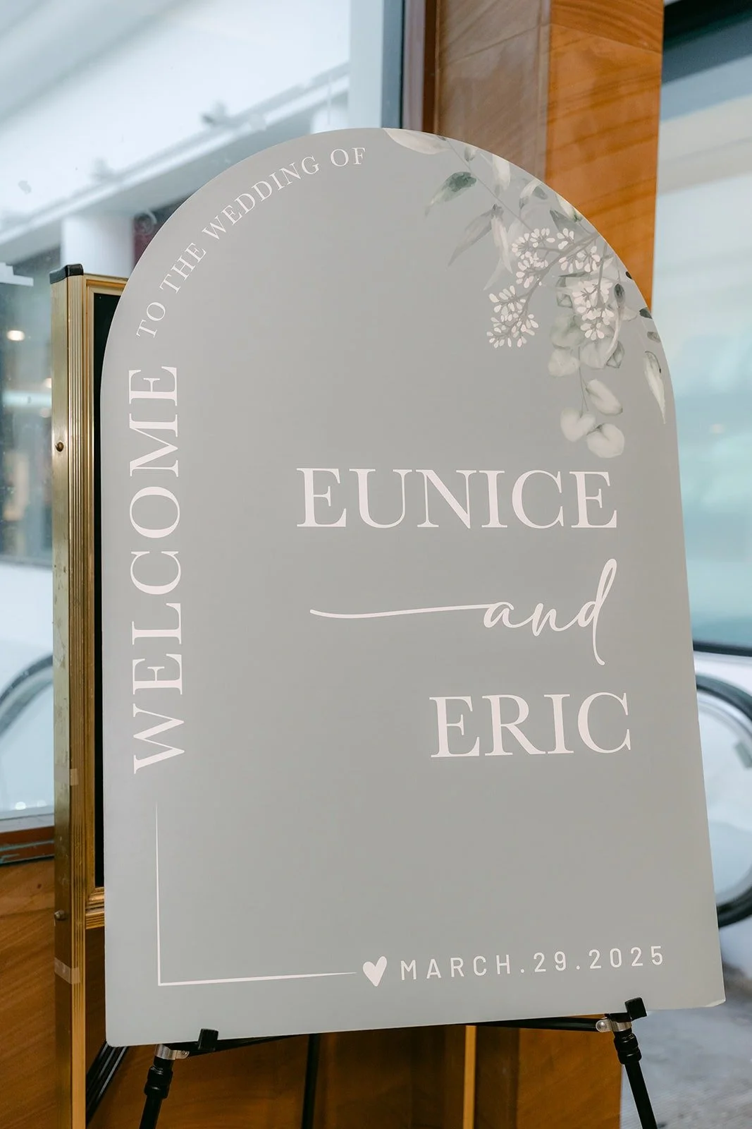 An arched welcome sign for Eunice and Eric at the reception