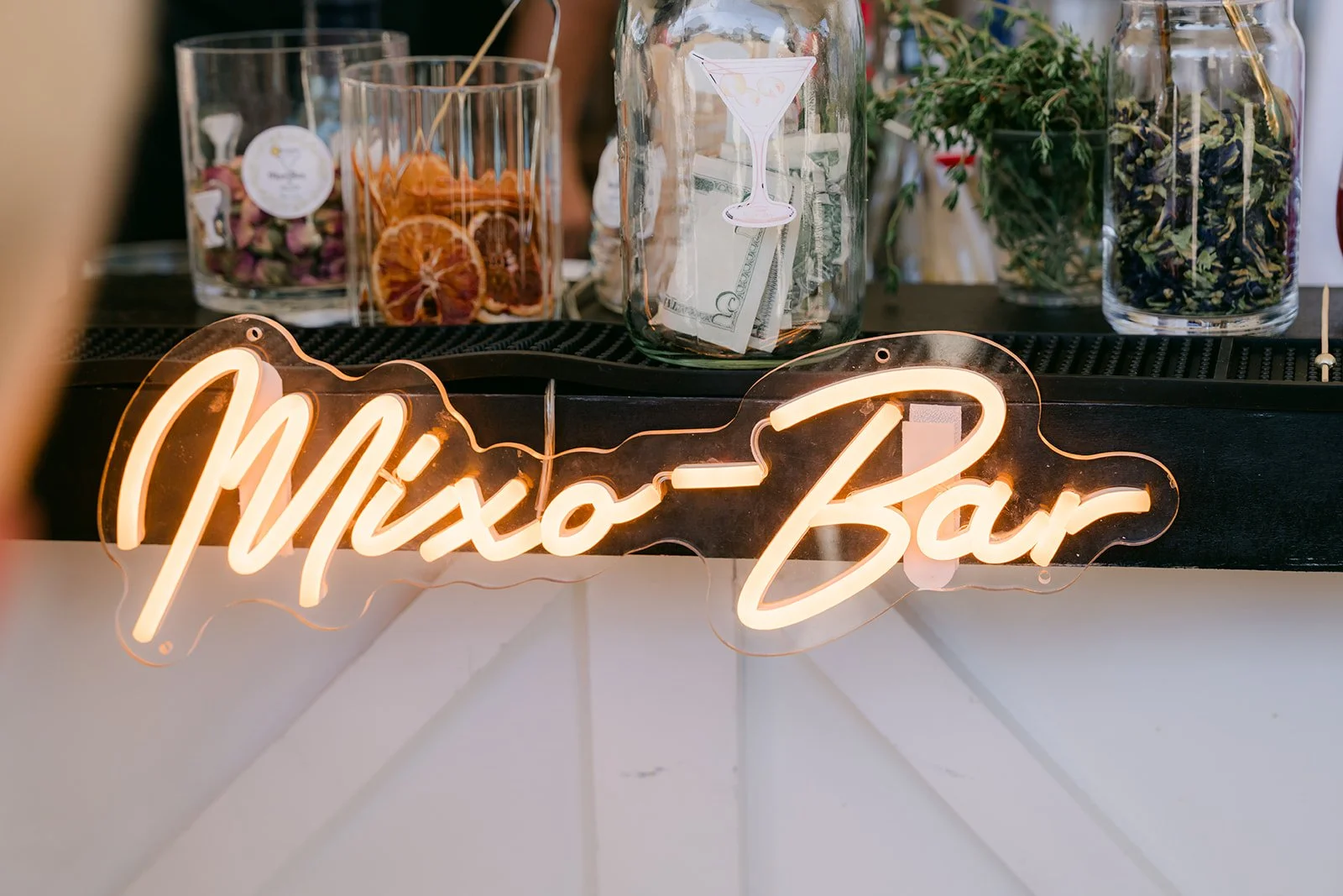 The Mixo Bar neon sign at the mobile bar.