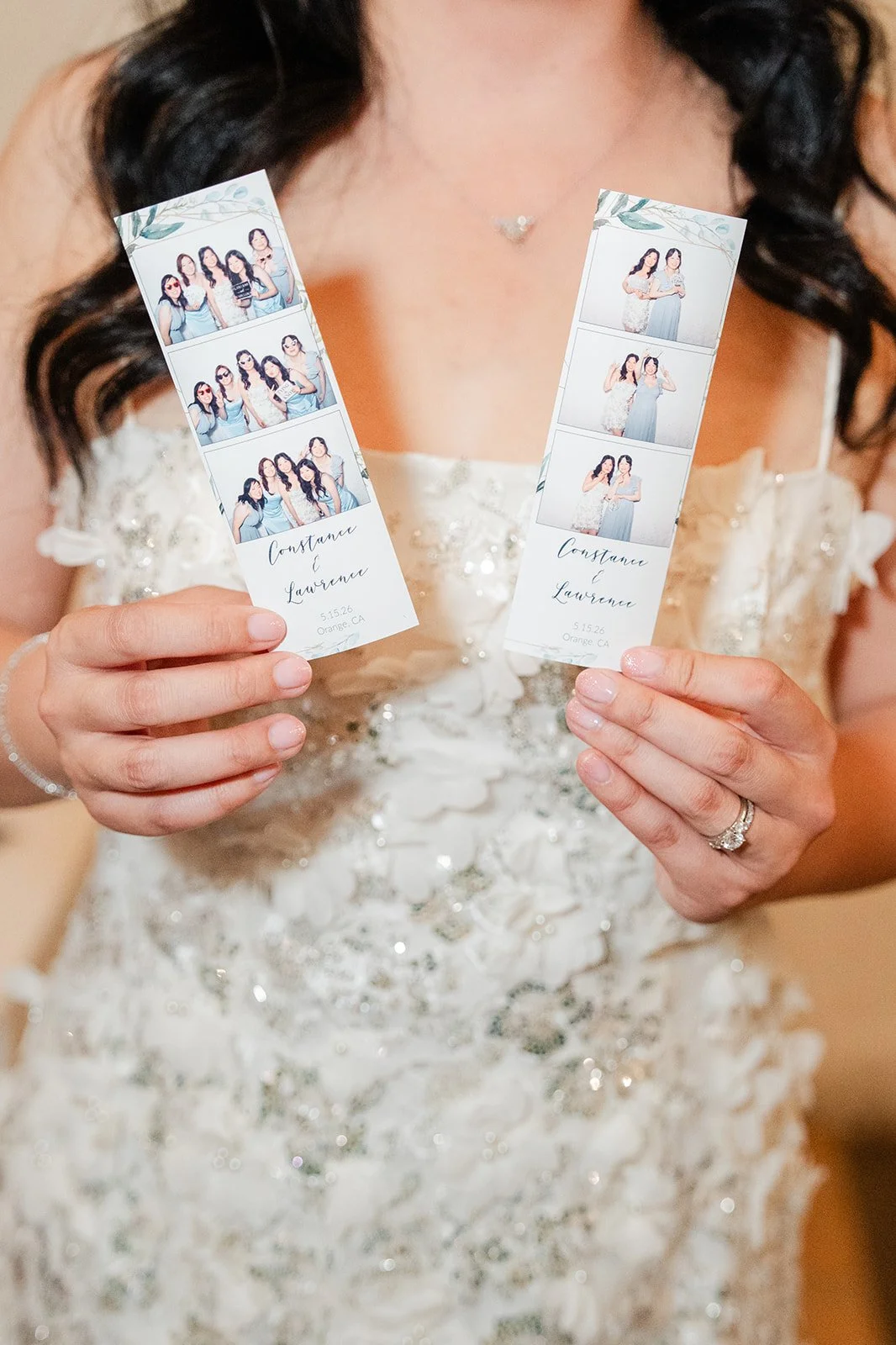 Constance holding photo booth strips in her sparkly dress, photographed by One and Only Production