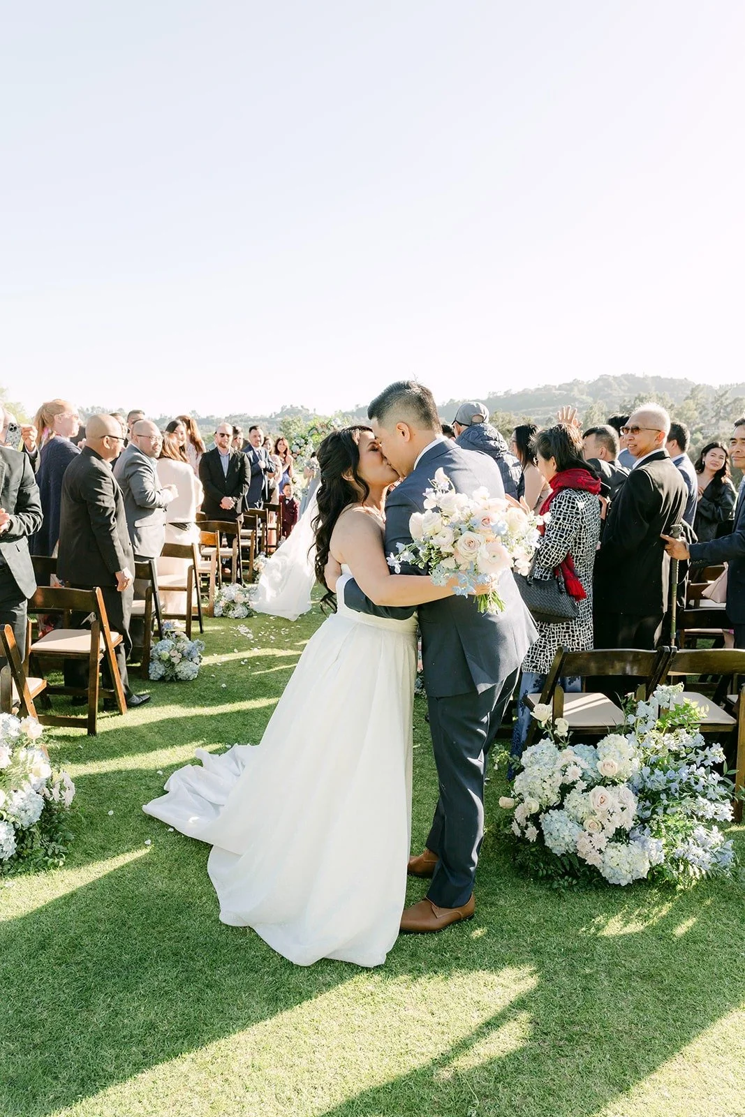Florence and Jordan kissing as husband and wife on the 15th hole, photographed by One and Only Production
