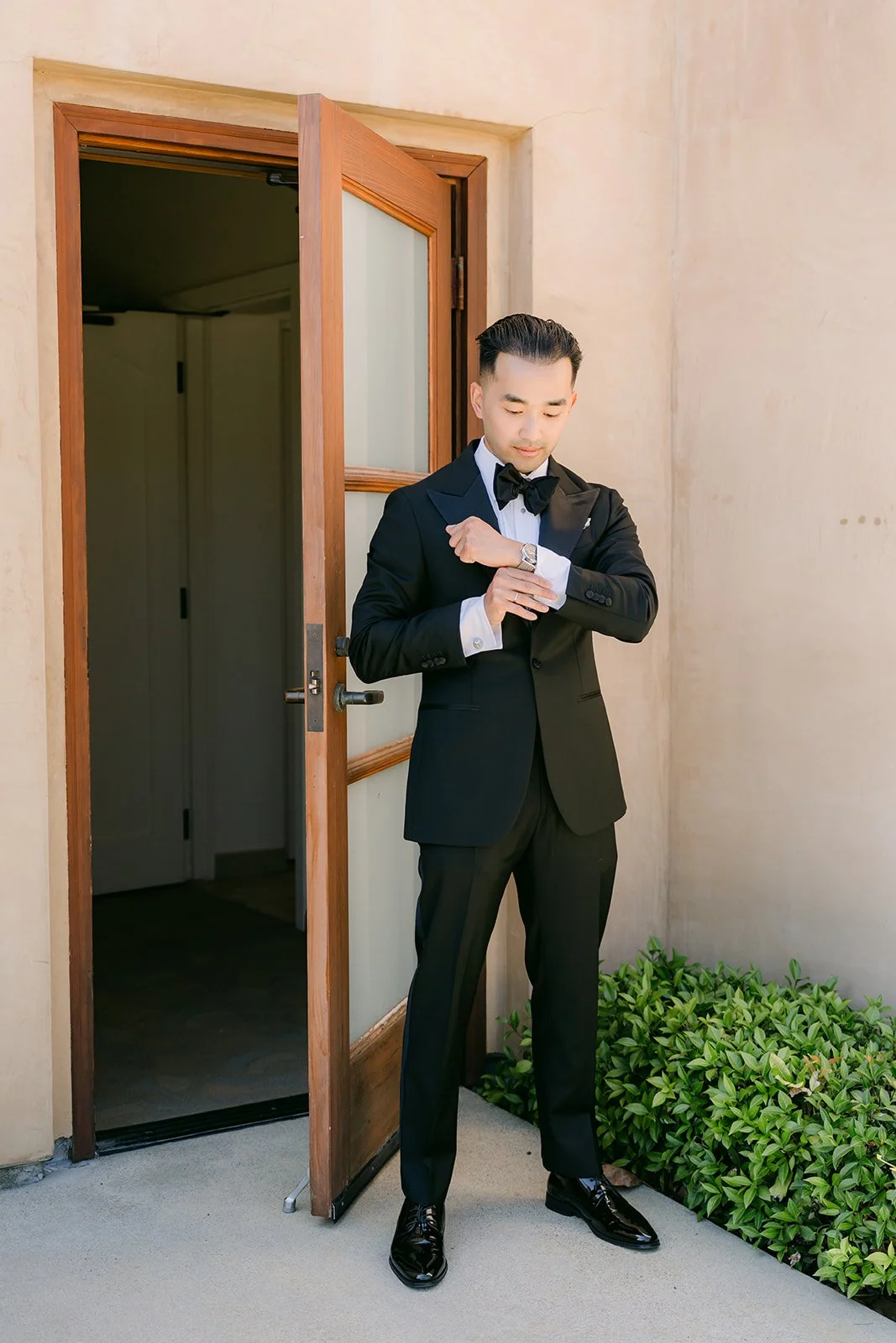 Vincent waiting outside the bridal suite door
