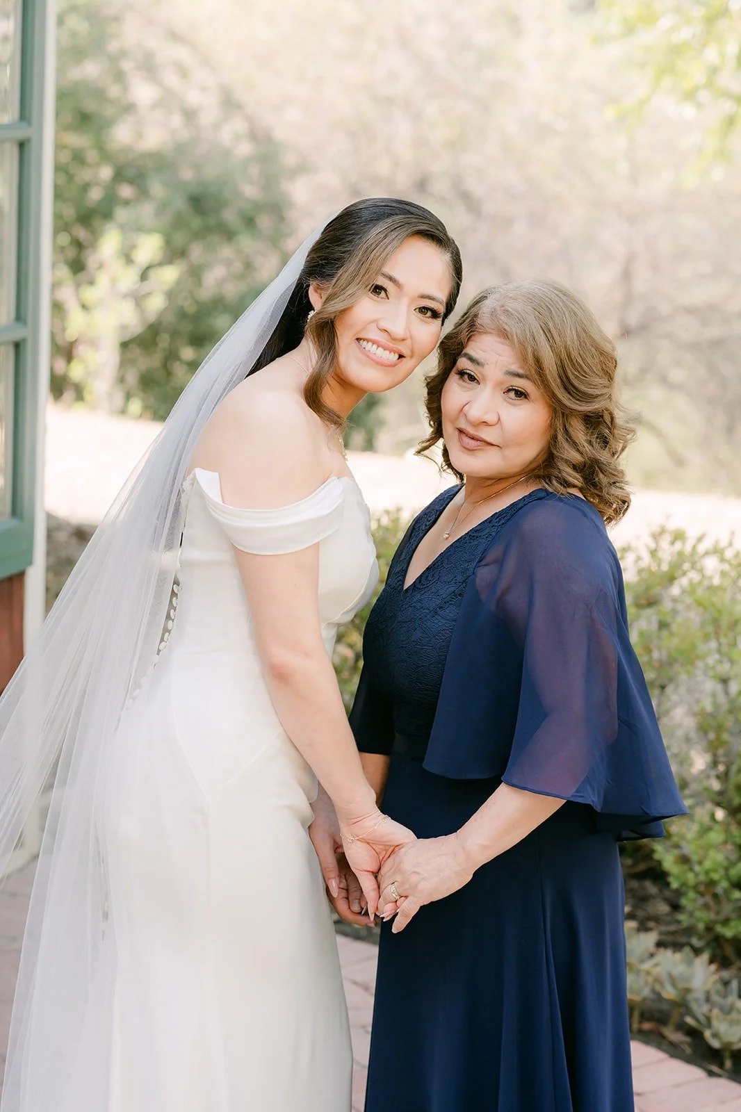 Mariana sharing a quiet moment with a family member before the ceremony, photographed by One and Only Production