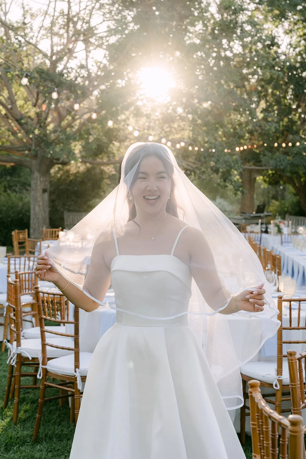 Saya tossing her veil in the sunset light at South Coast Botanic Garden