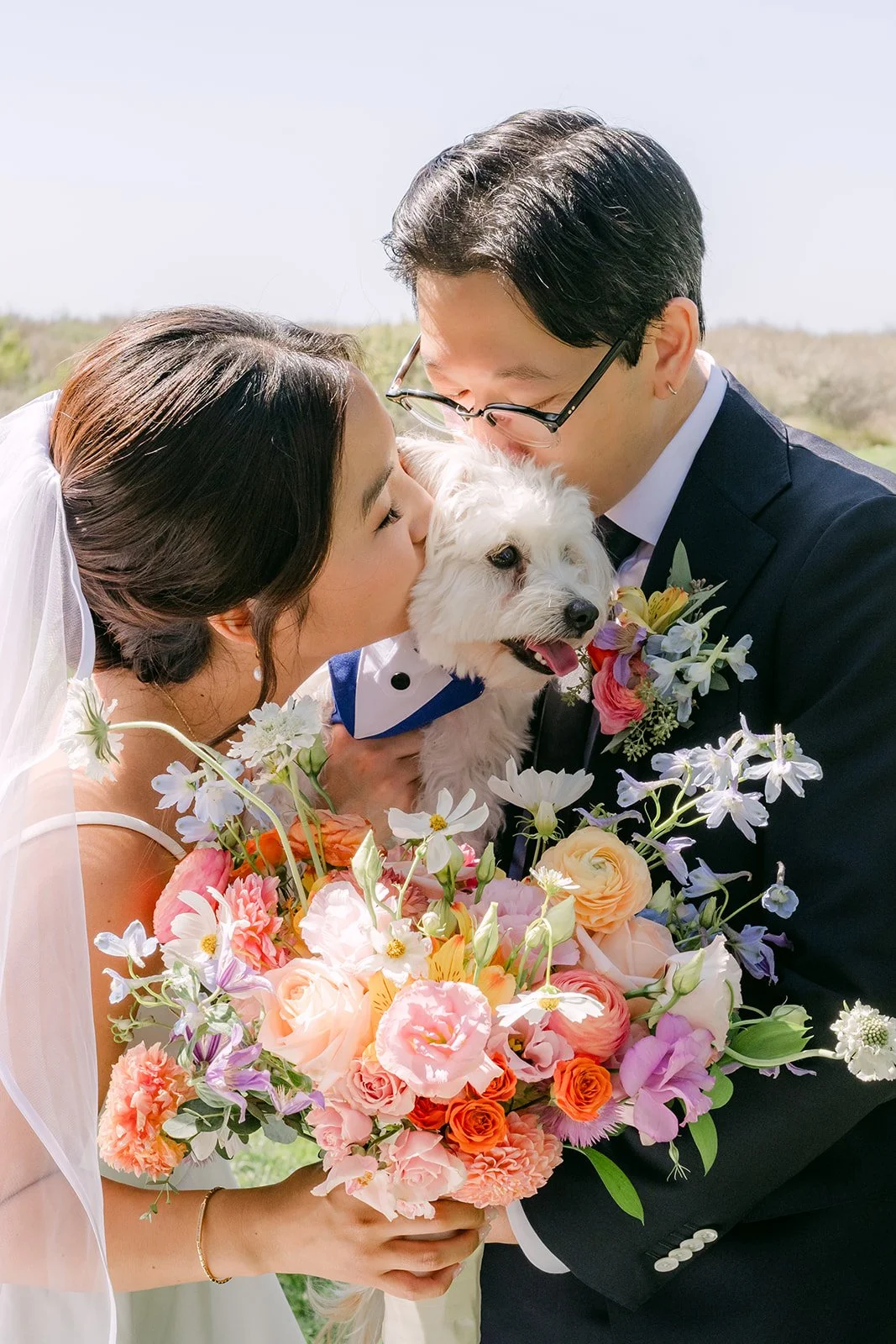 A kiss for the pup between Saya and Leroy