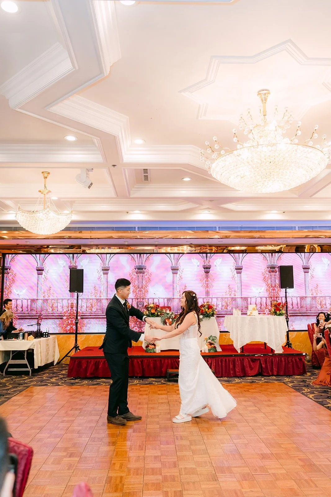 Shayna and Robert dance under the chandelier