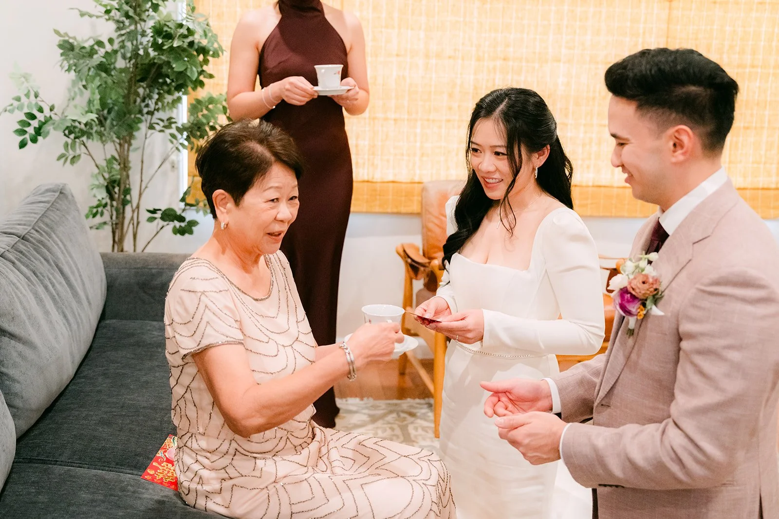 Denise's mom smiling over her teacup.