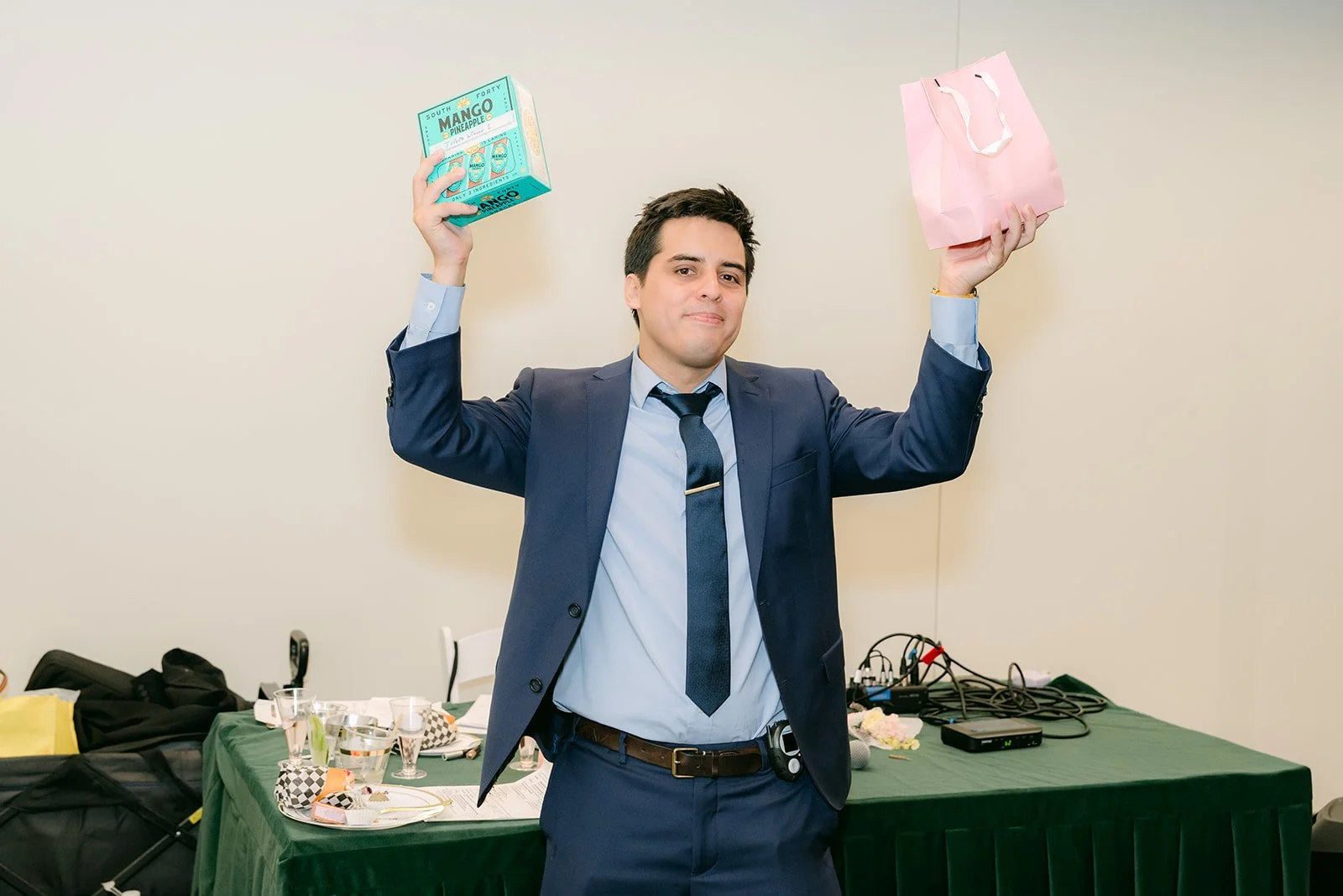 A guest holds up items in triumph during the 收買佬 game.
