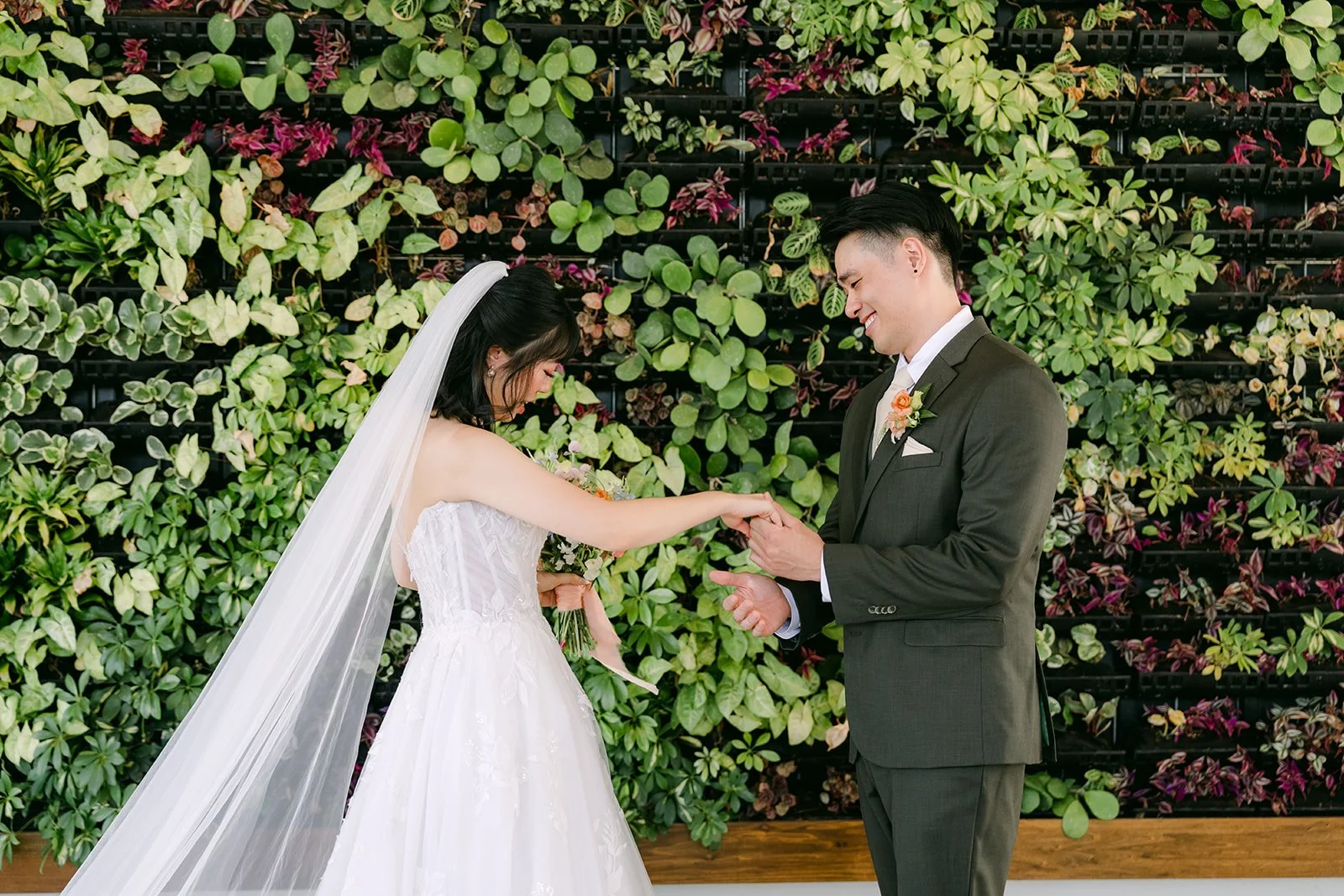 Alex turning to see Vivian for the first time at The Colony House living wall