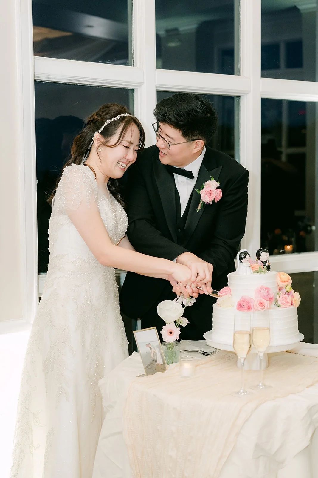 Judy and Joshua laughing over the cake