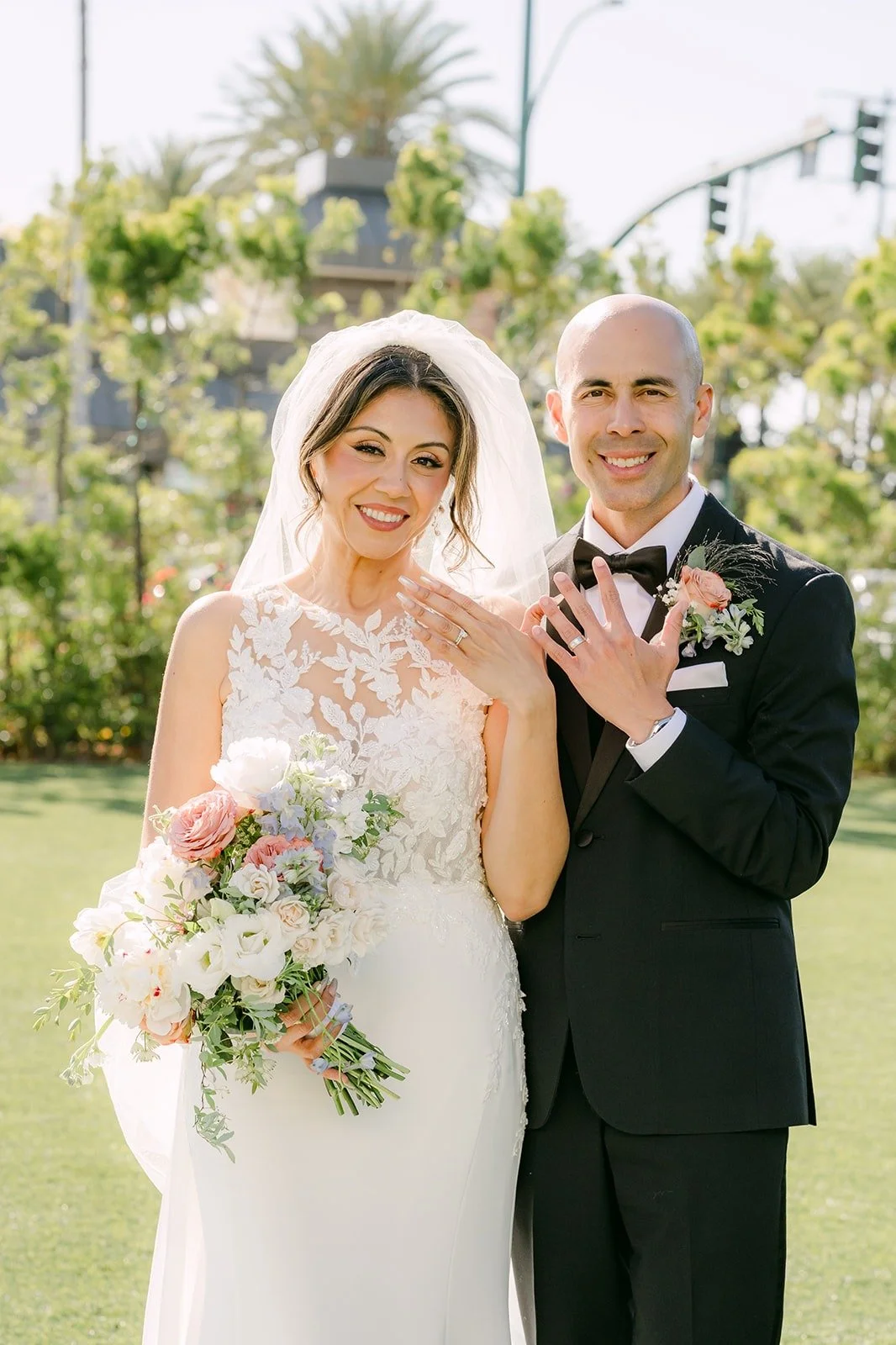 Francesca and Daniel smile together on the lawn at The Westin Anaheim Resort