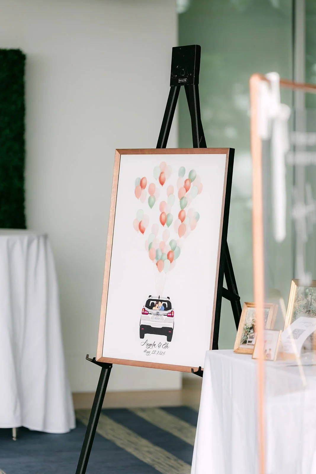 The homemade seating chart on an easel