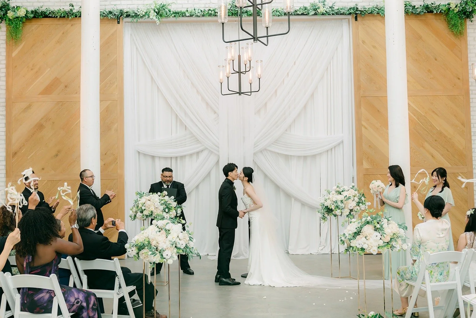 Guests watching the ceremony in the white chapel