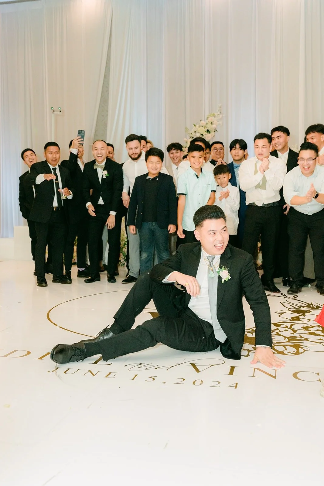 A groomsman diving for the garter