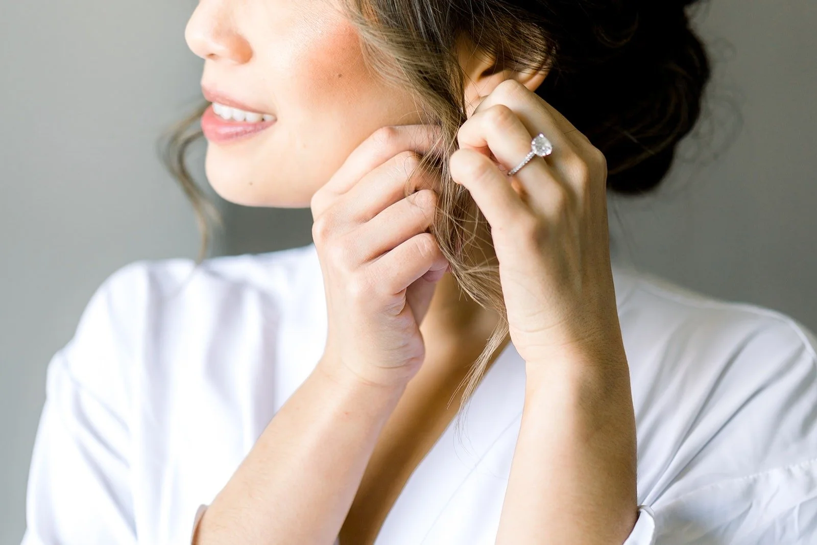 Josephine putting on her earrings