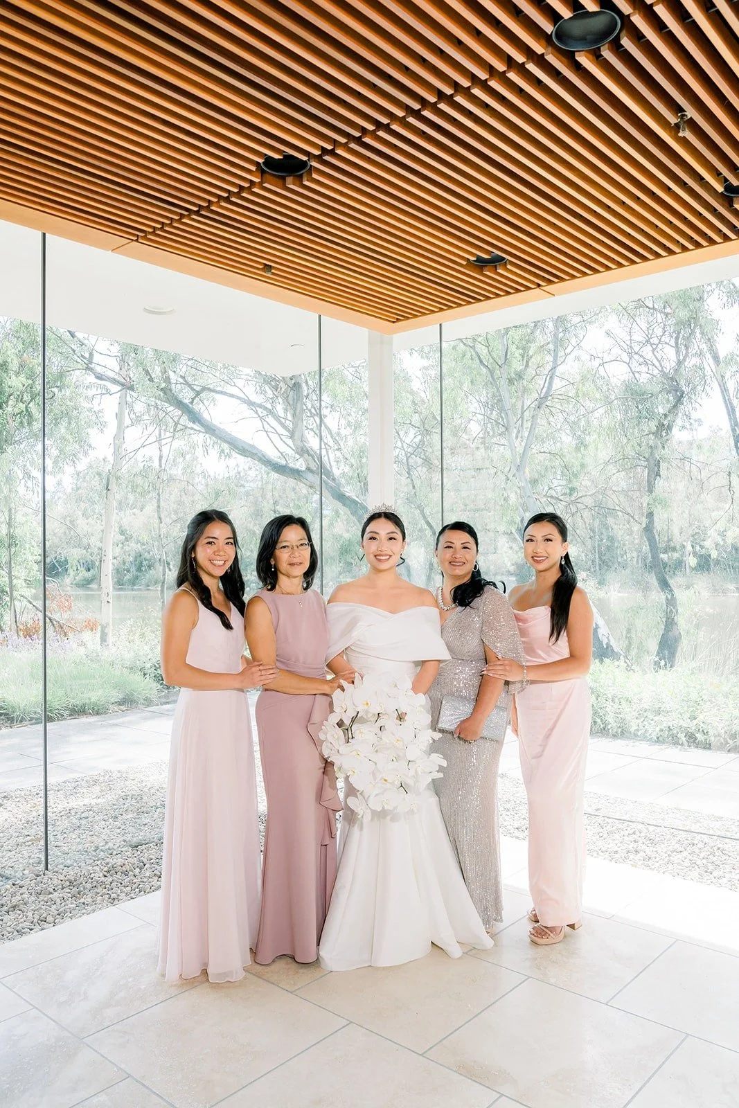 Jacinda with her bridesmaids in blush