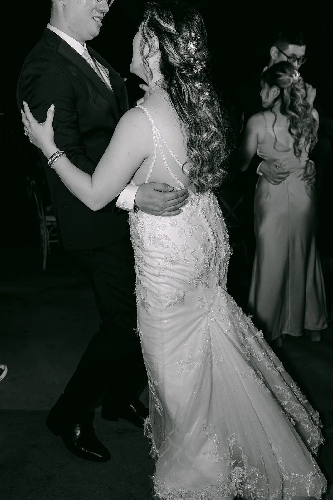 Joanne dancing on the dance floor in black and white