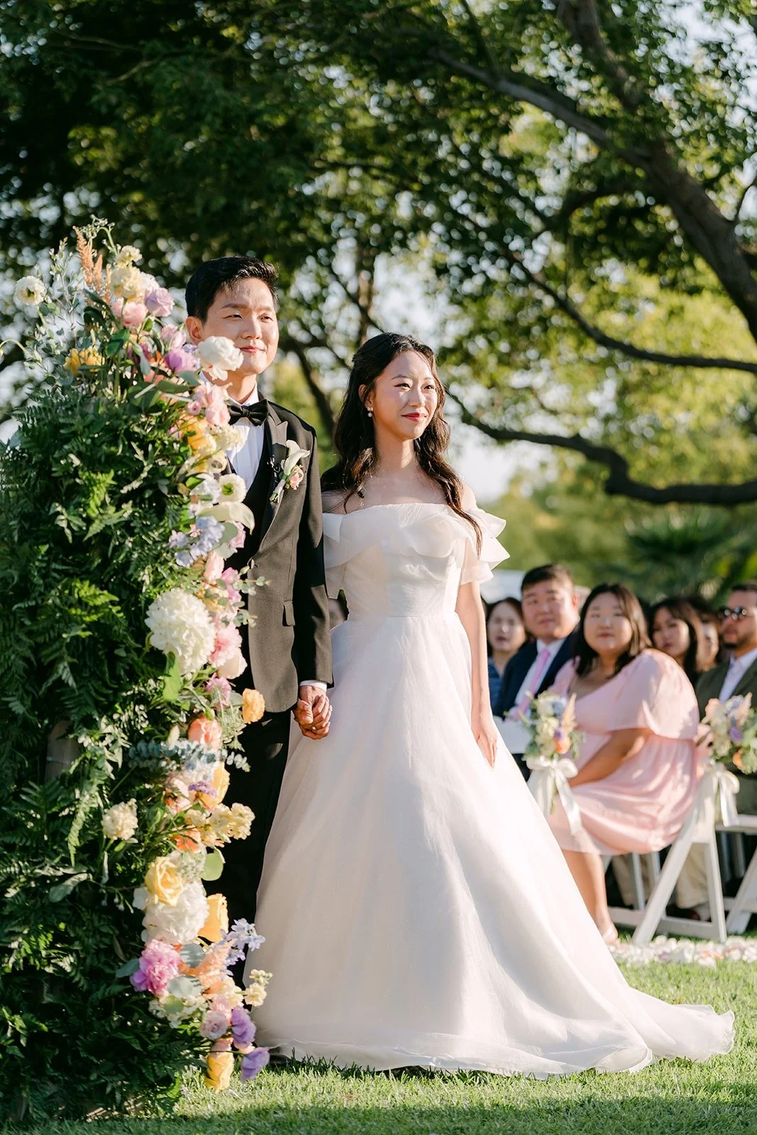 Jeannie smiling at the guests during the ceremony