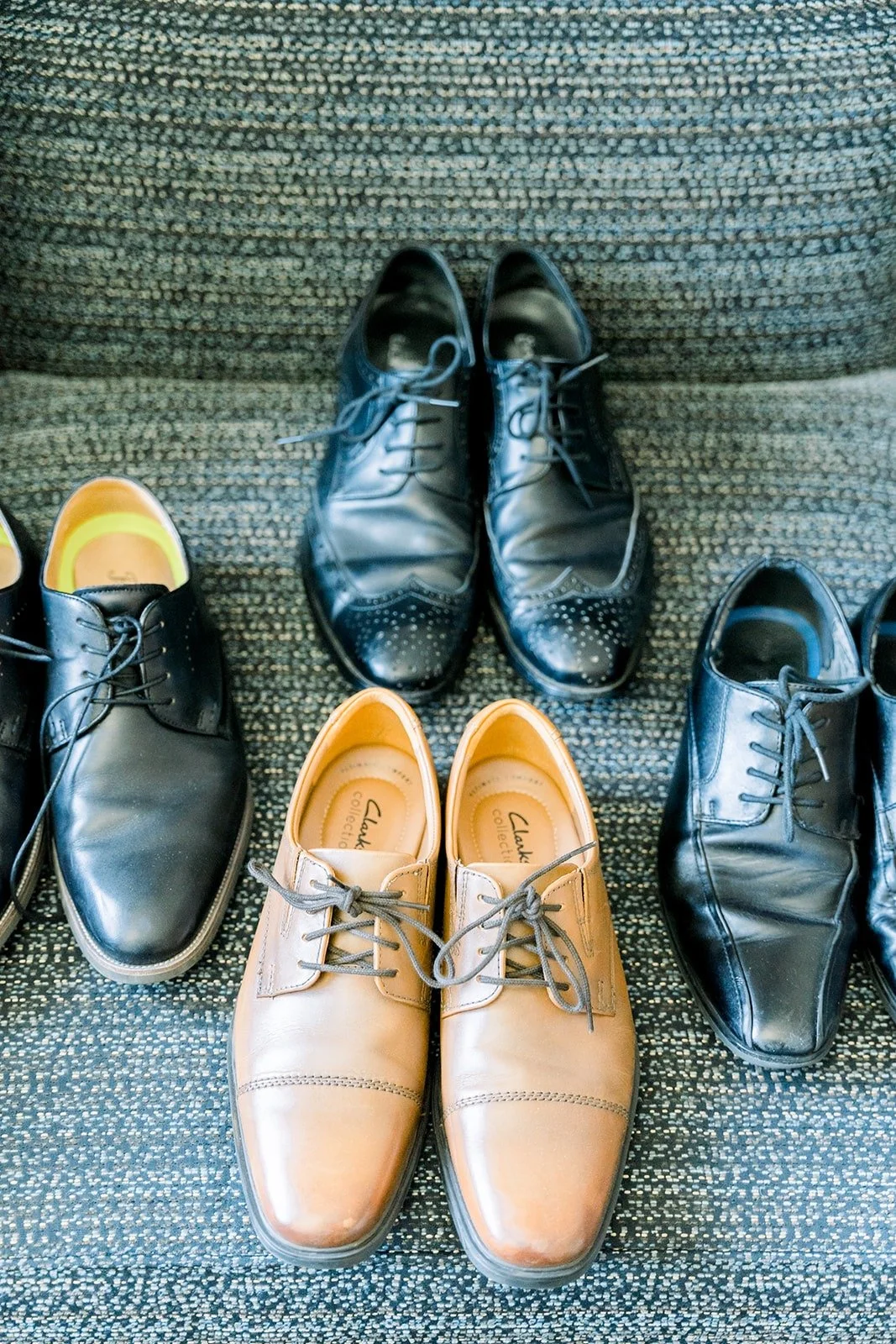 Alex's shoes lined up with the groomsmen's black dress shoes