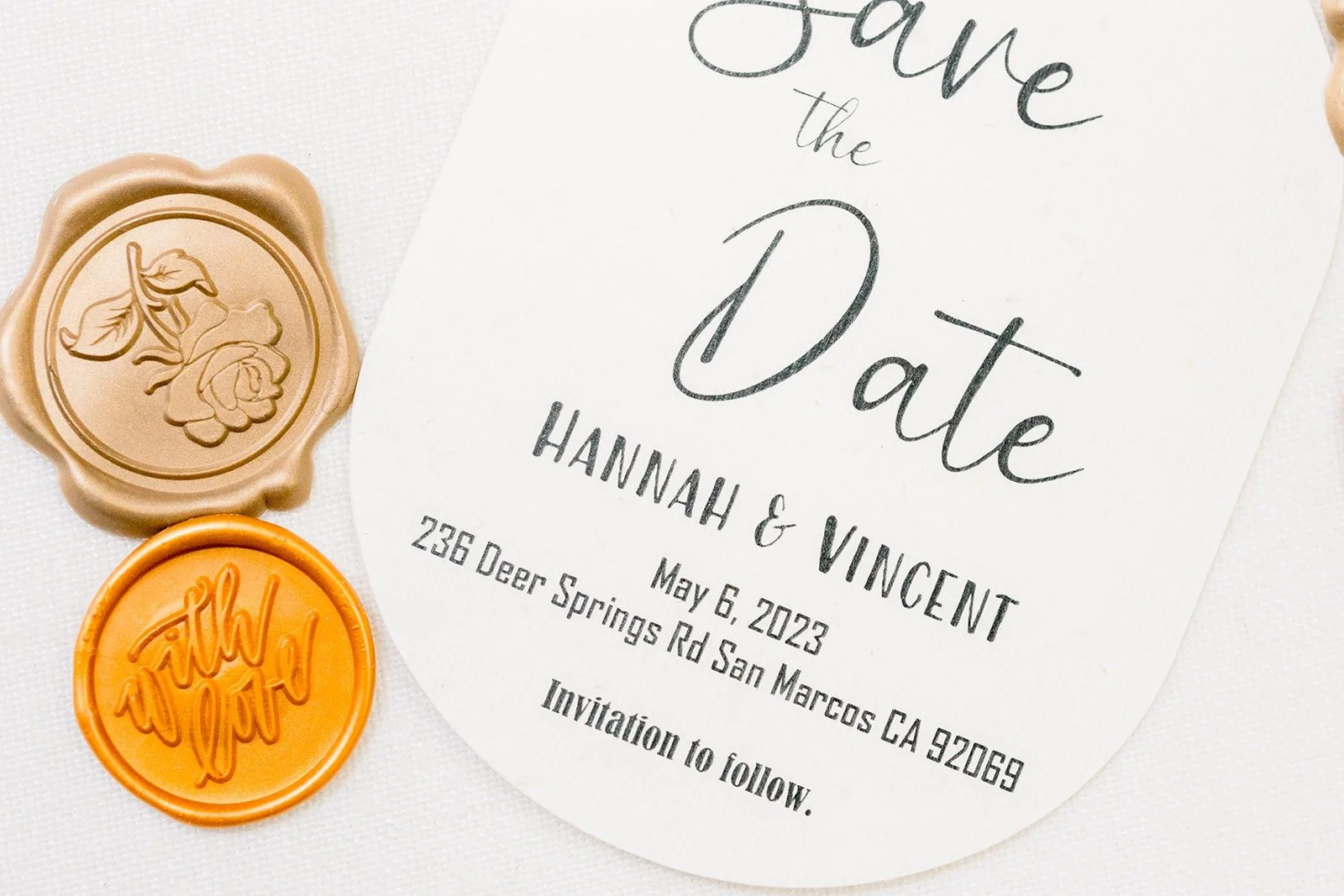 Save the date card for Hannah and Vincent with a gold wax seal