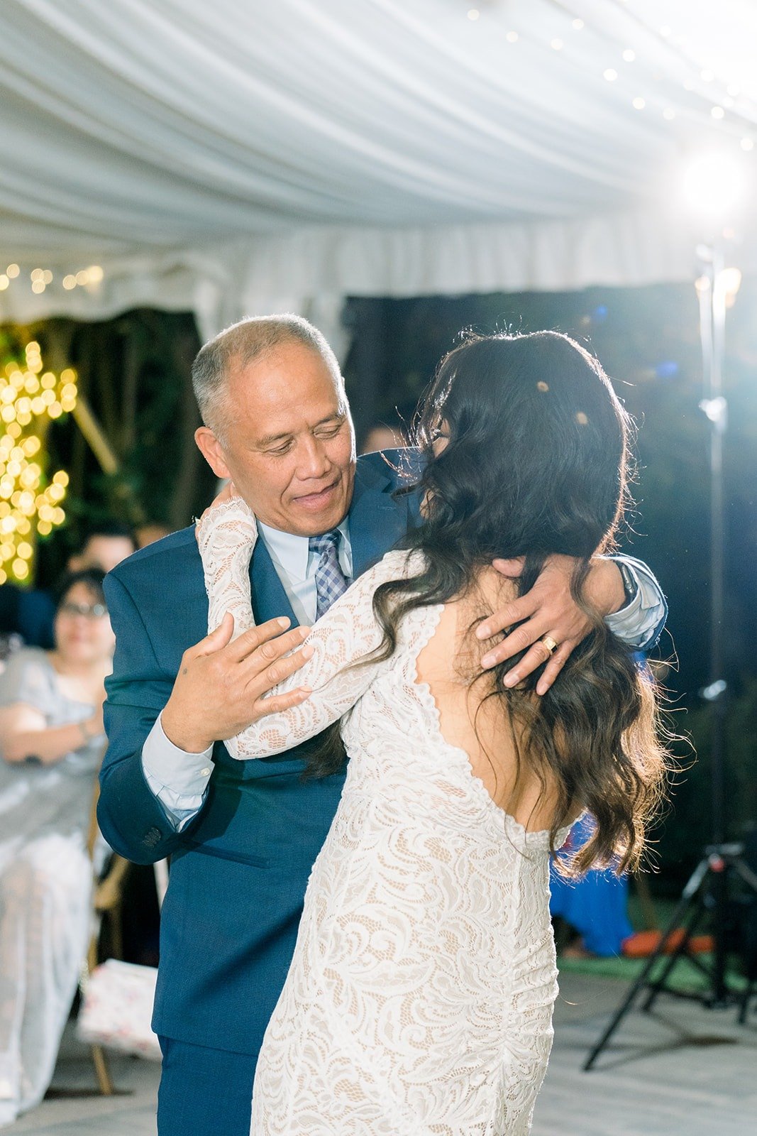 Hannah sharing a dance with a family member