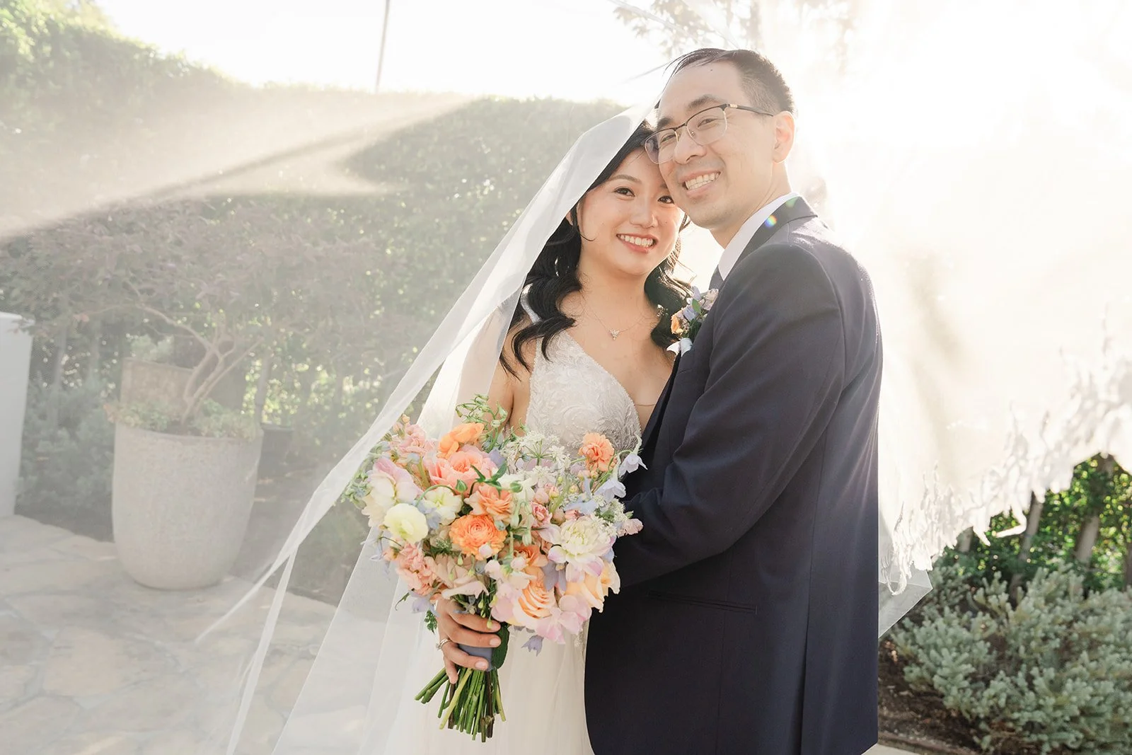 Veil floating in the air in front of the couple at Grand Gimeno
