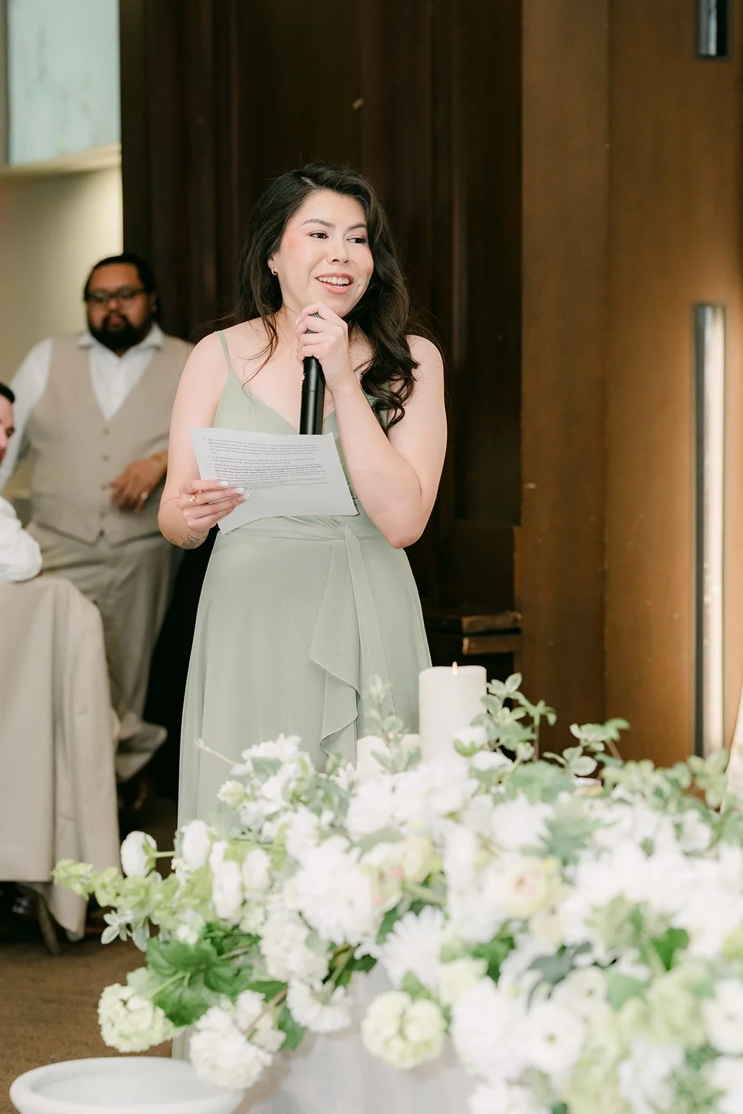 A bridesmaid giving a toast.