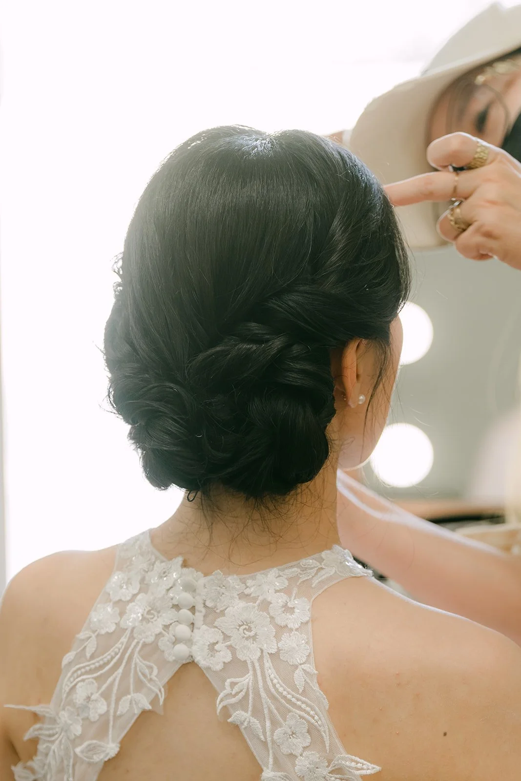 Elaine's updo and the lace back of her gown.