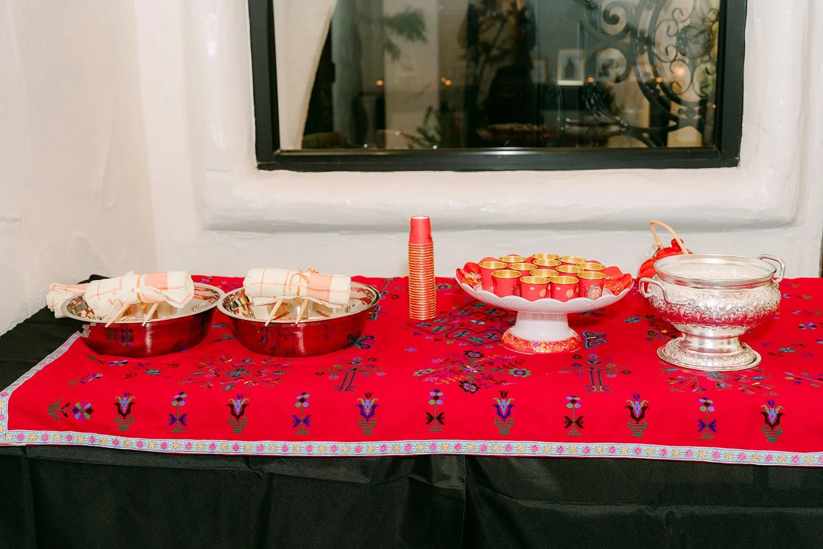 Red table set for the Mien door greeting
