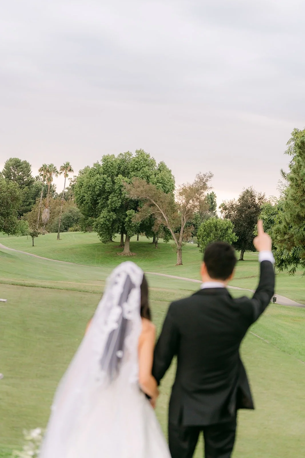 William cheering beside Kristine on the open fairway