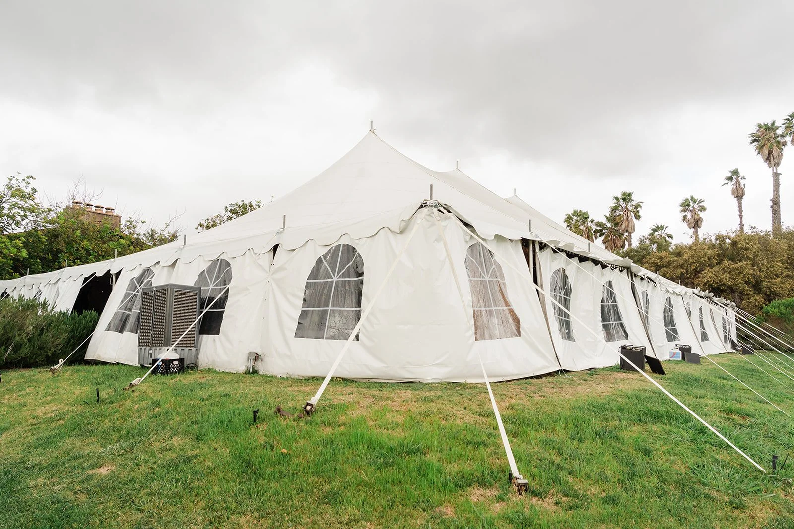 Peaked white reception tent on the lawn at Ethereal Gardens