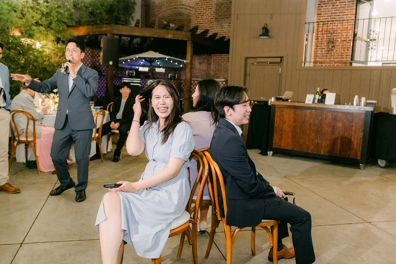 Guests laughing during a game at Franciscan Gardens