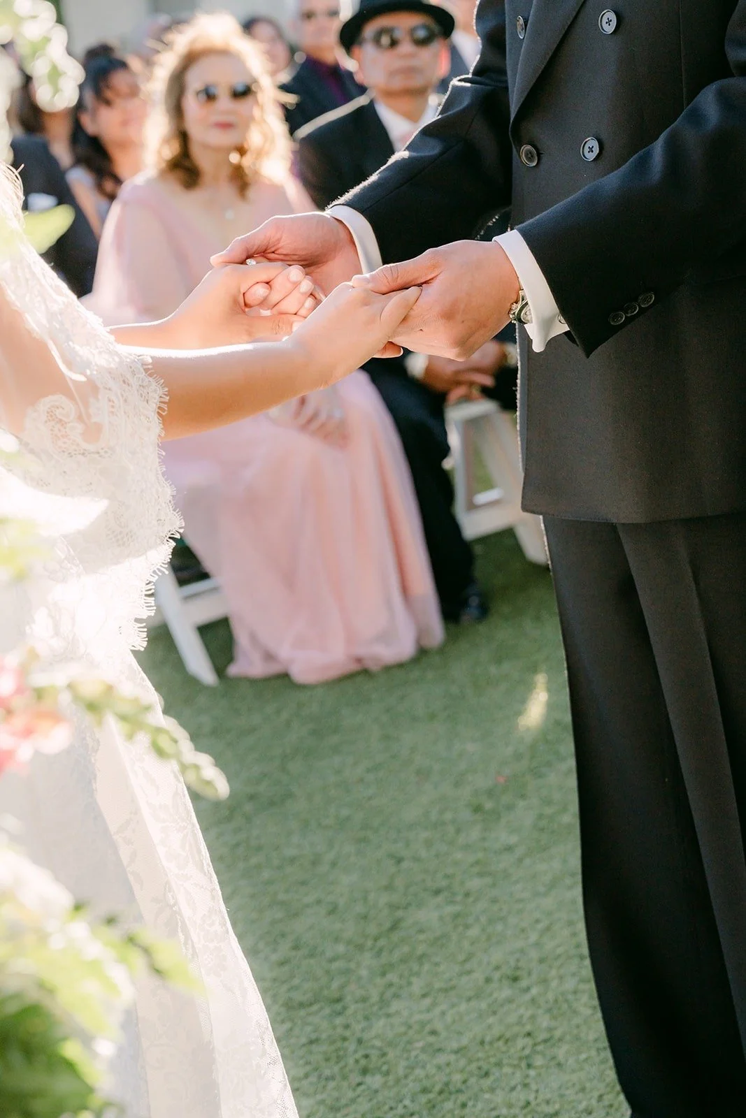 Job taking Konitha's hand at the end of the aisle