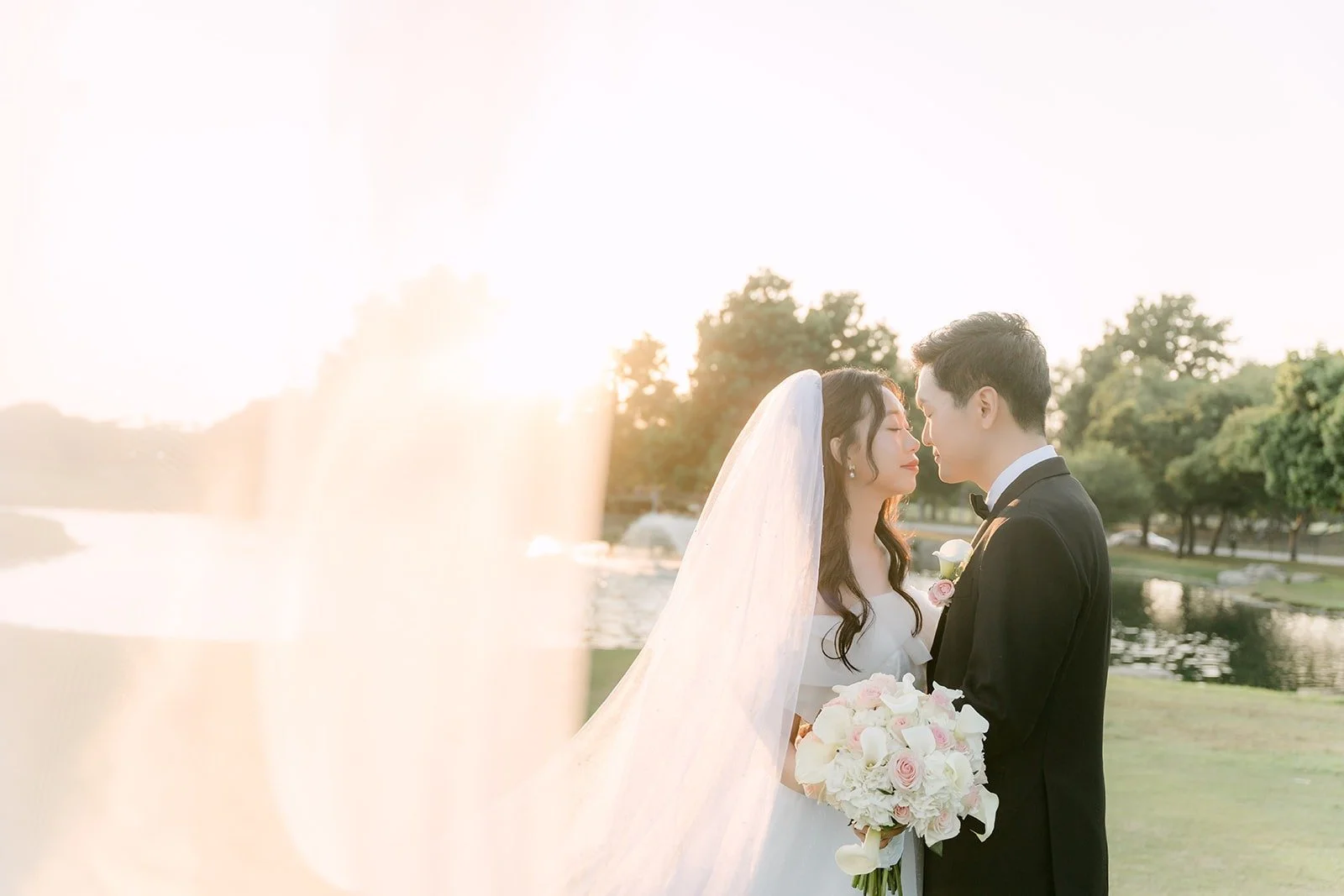 Jeannie and Eunsang sharing a kiss in the sunset glow