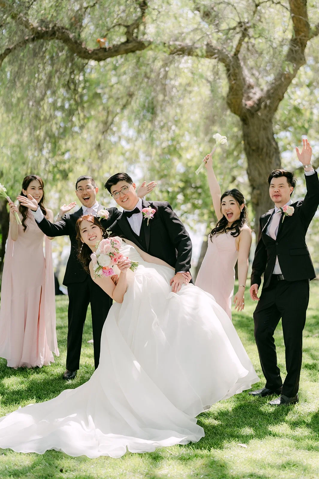 Joshua dipping Judy in front of the wedding party