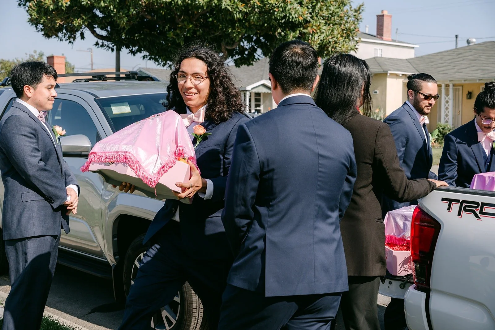 James and his groomsmen arriving at the house with gifts